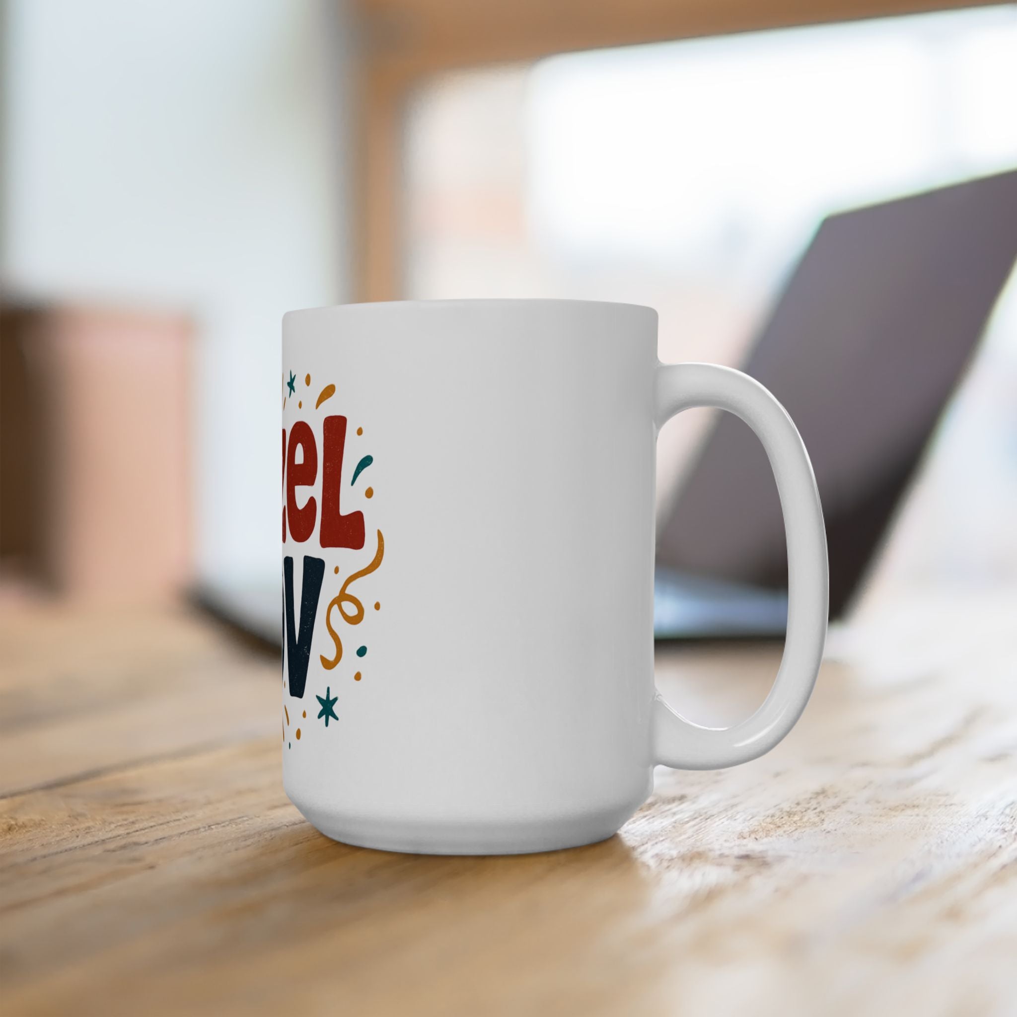 White mug with colorful text on a wooden surface