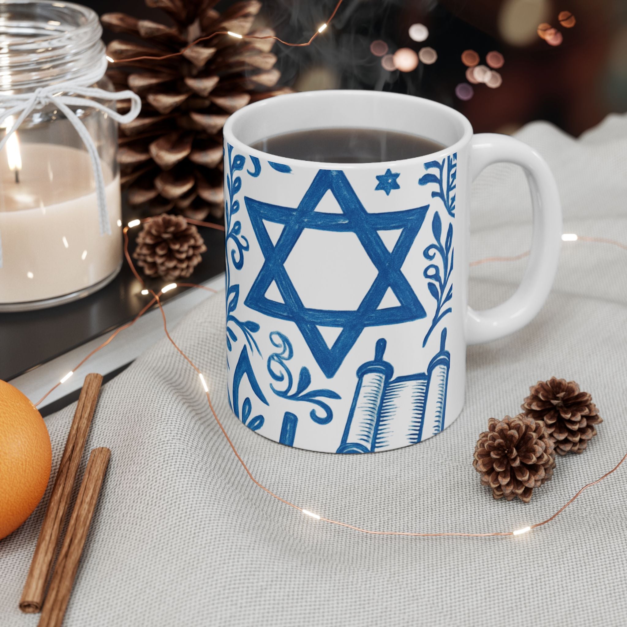 Mug with Star of David design on a table with decorative items