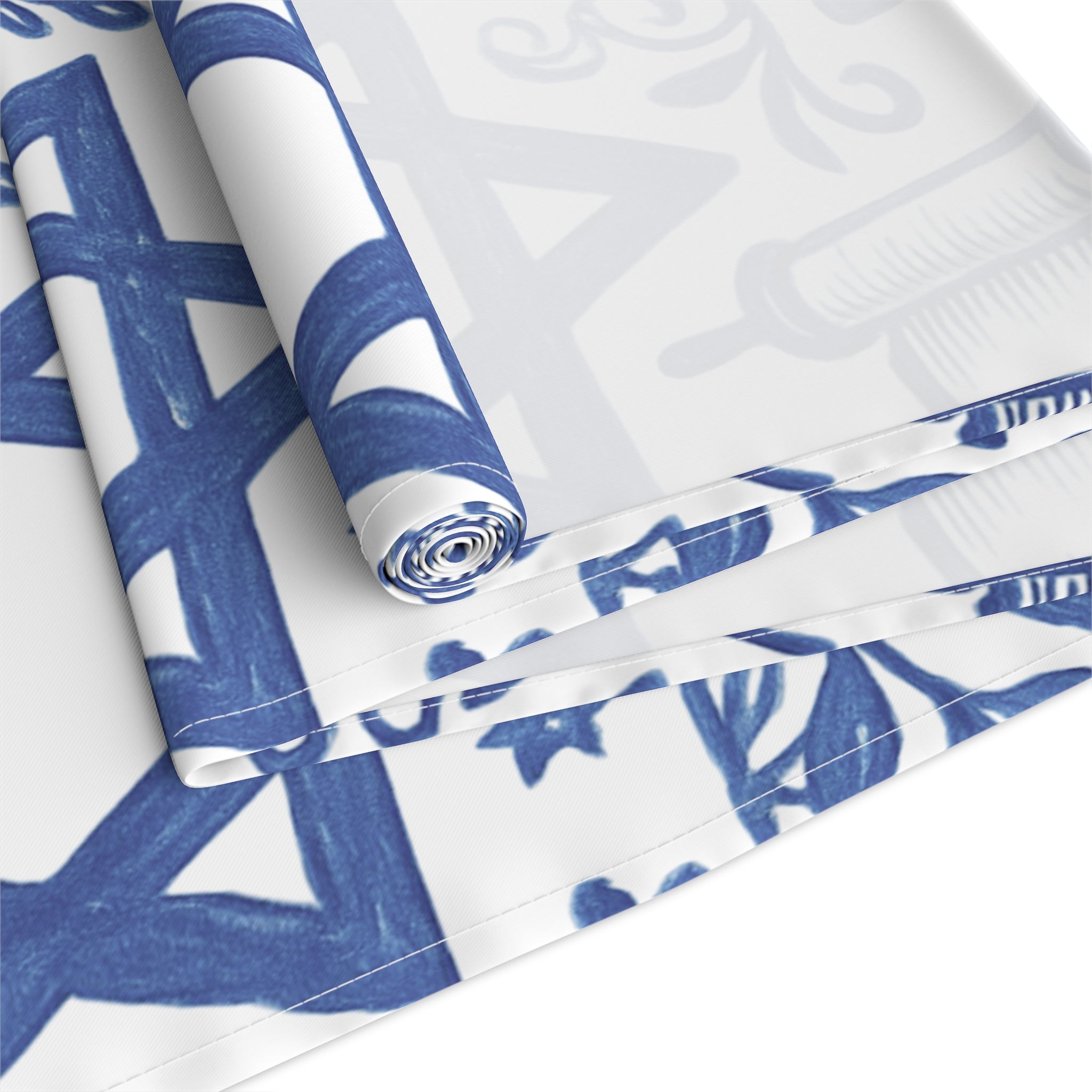 Roll of blue and white patterned paper on a white background