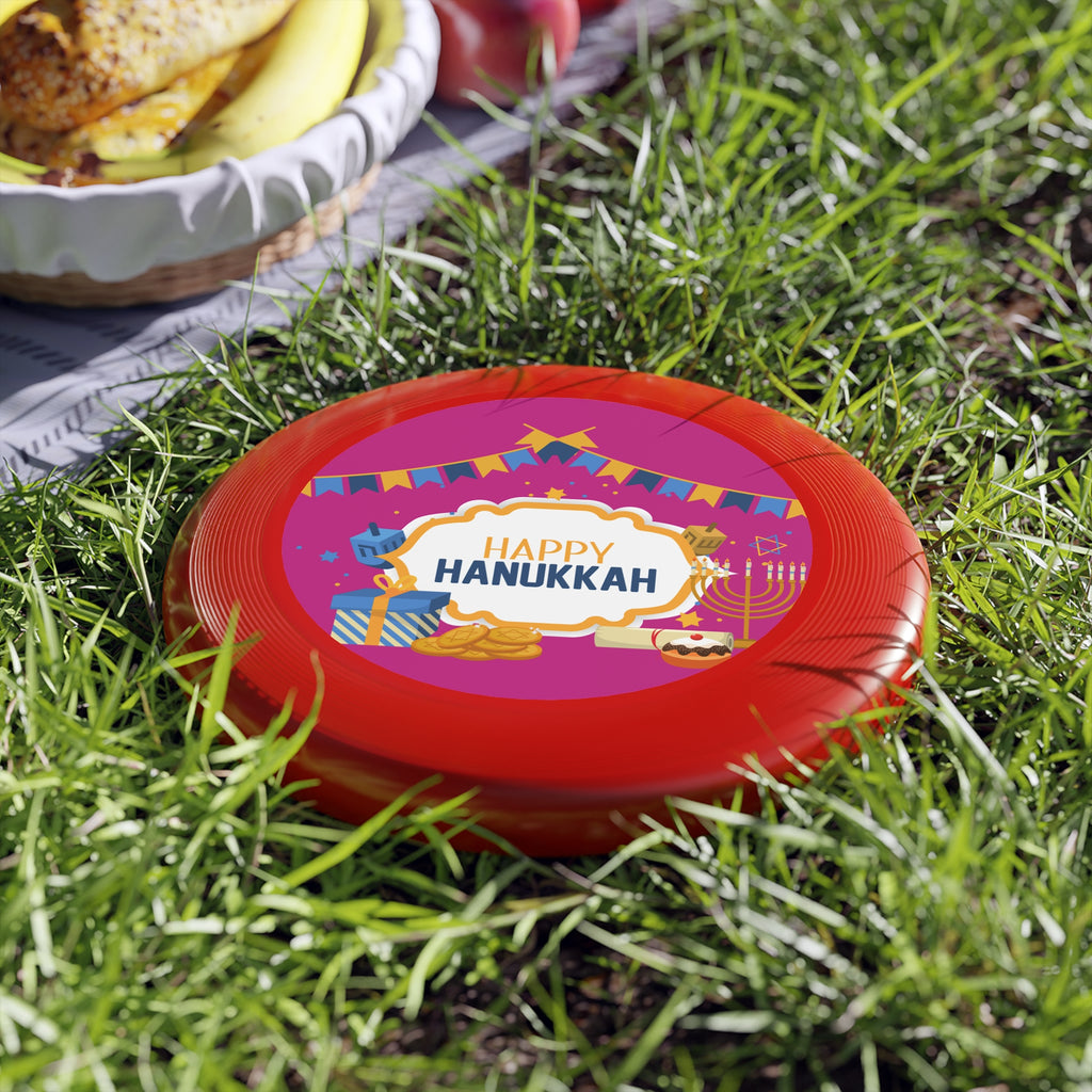 Red lid with 'Happy Hanukkah' text on grass