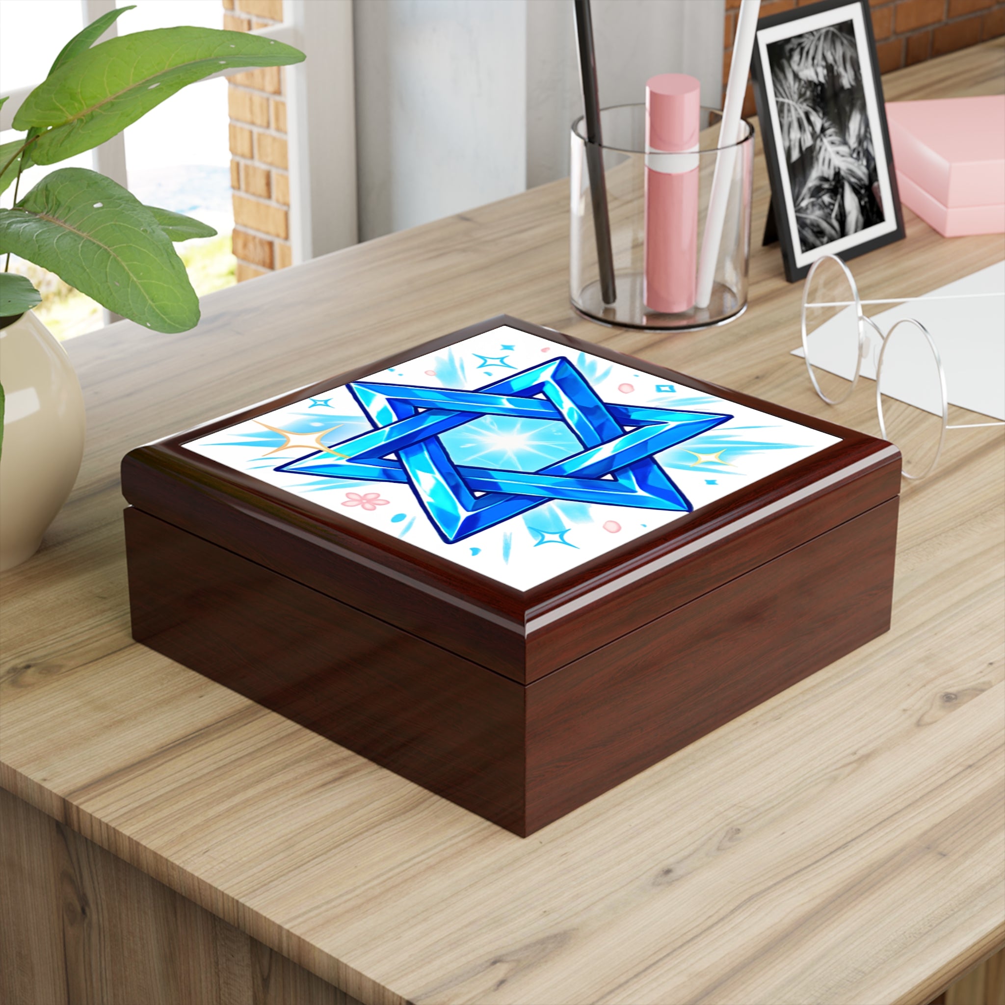 Wooden box with a blue star design on a wooden surface
